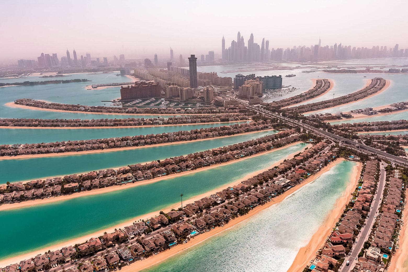 Aerial photograph of Palm Jumeirah’s fronds, beaches and Dubai skyline
